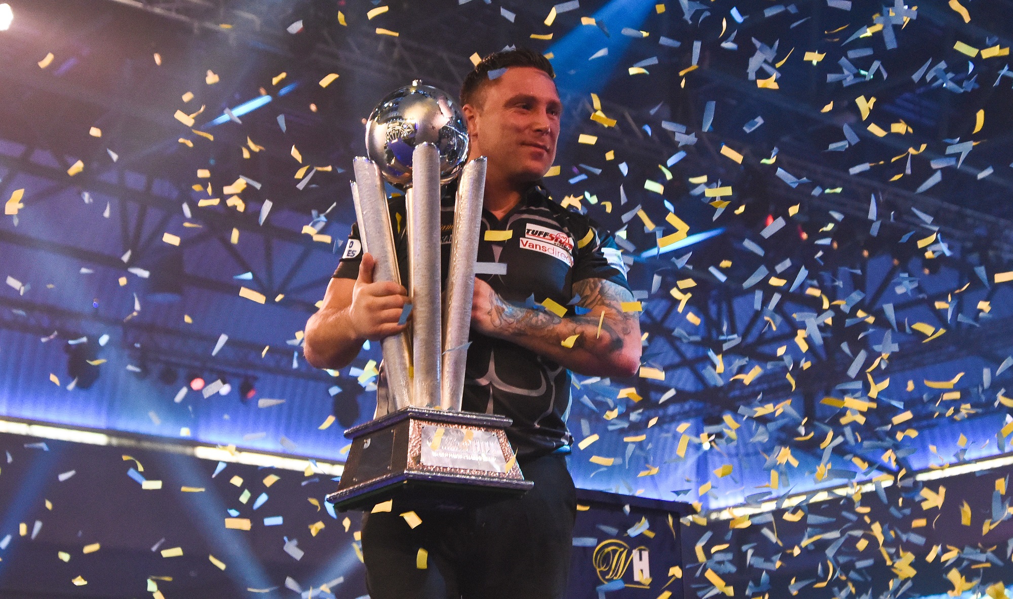 Gerwyn Price lifts the World Darts Championship trophy. On of the biggest success stories of Q-School