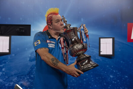 Peter Wright holding the Betfred World Matchplay title