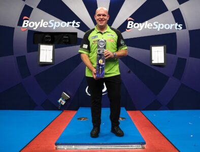 Michael van Gerwen holding the World Grand Prix trophy