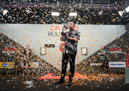 Chris Dobey lifts The Masters trophy and earns a Premier League Darts place.