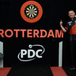 Nathan Aspinall celebrates his Premier League Darts night win in Rotterdam in 2023.