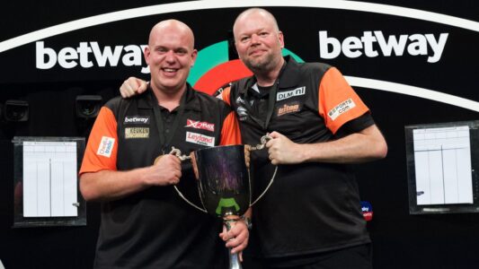 Michael van Gerwen and Raymond van Barneveld celebrating their 2018 World Cup of Darts win.