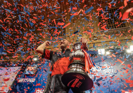 Nathan Aspinall celebrates winning the 2023 Betfred World Matchplay Darts.