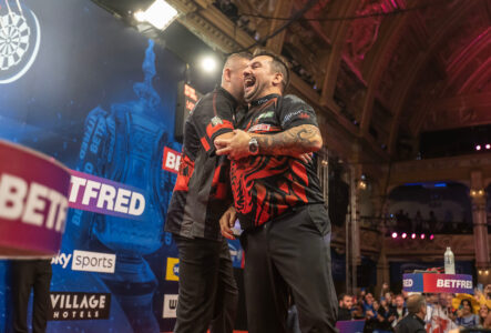 Nathan Aspinall and Jonny Clayton embrace before the action starts