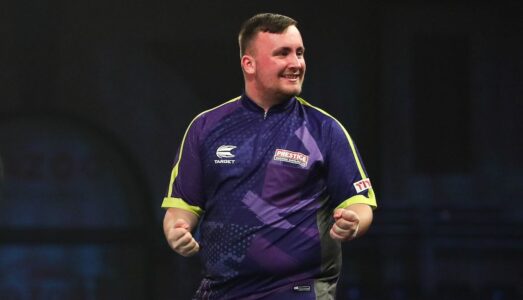 Luke Littler playing darts