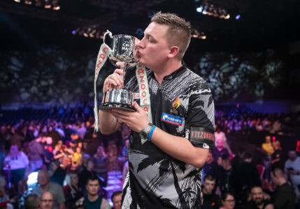 Chris Dobey celebrates winning The Masters