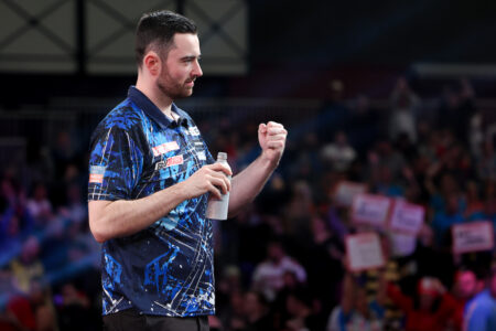 Luke Humphries celebrates winning a match at the 2024 UK Open