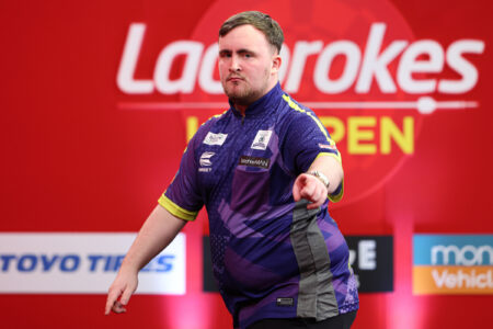 Luke Littler on stage at the 2024 UK Open