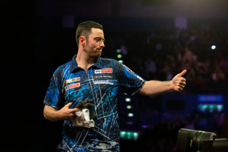 Luke Humphries on stage during the 2024 BetMGM Premier League Darts