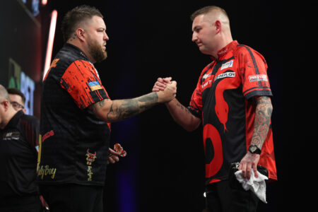 Nathan Aspinall and Michael Smith on stage in the 2024 BetMGM Premier League Darts.