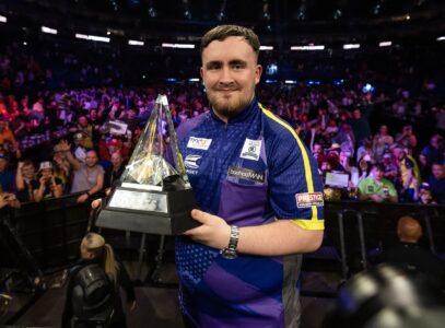 Luke Littler holds the Premier League title.
