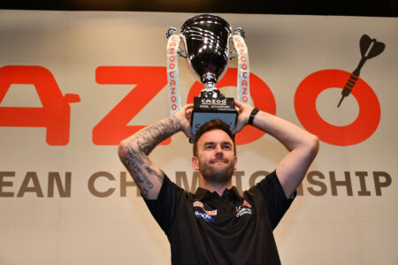 Ross Smith lifts the 2022 European Championship Darts trophy.