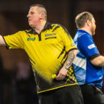 Dave Chisnall and Cameron Menzies playing on stage
