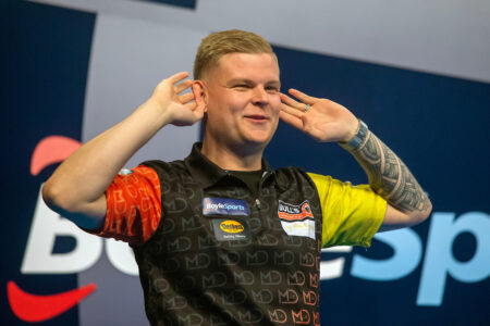 Mike De Decker celebrates reaching the World Grand Prix Final. Credit: PDC