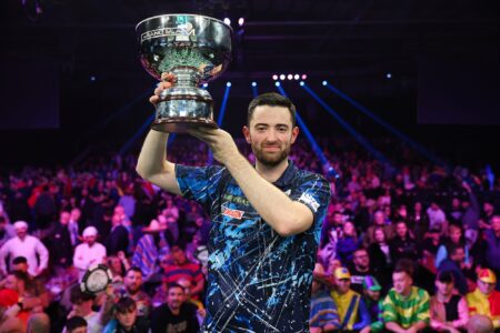 Luke Humphries holding the Grand Slam of Darts trophy