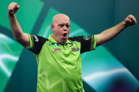 Michael van Gerwen celebrates on stage at the Paddy Power World Darts Championship.