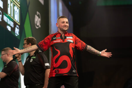 Nathan Aspinall on stage at the 2025 Paddy Power World Darts Championship.