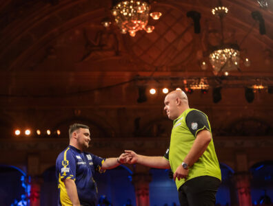 Michael van Gerwen and Luke Littler on stage at the 2024 Betfred World Matchplay.