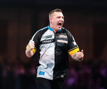 Chris Dobey on stage at the 2025 Paddy Power World Darts Championship.