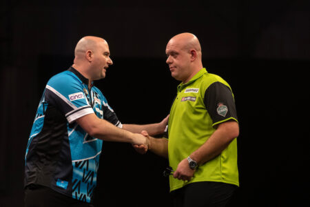 Rob Cross and Michael van Gerwen shake hands after their game on night four of the 2025 Premier League Darts.