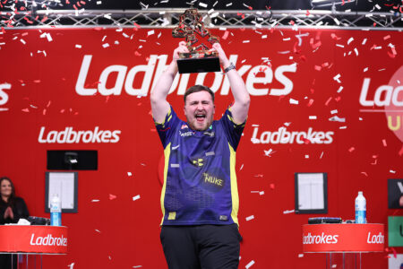 Luke Littler lifting the UK Open trophy.
