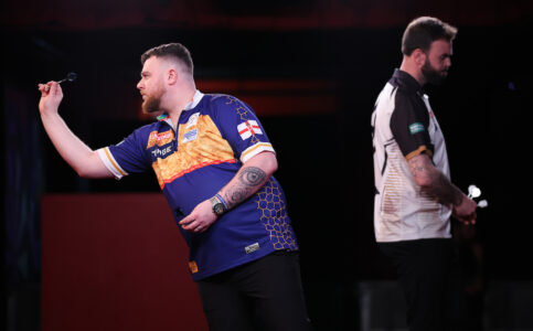 Josh Rock playing on stage at the 2025 UK Open darts.