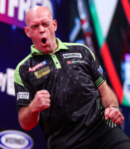 Michael van Gerwen roaring with a pumped fist on the Empress Ballroom stage after securing his 10-6 opening-round victory over Andrew Gilding at the 2026 world matchplay